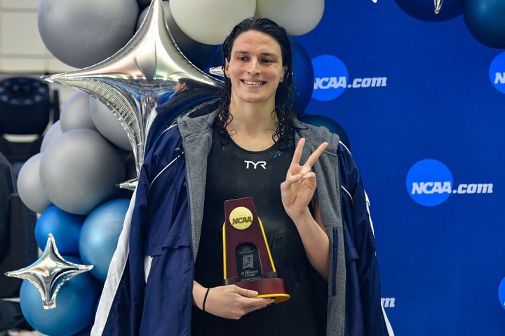 Then-University of Pennsylvania swimmer Lia Thomas accepts the winning trophy for the 500 Freestyle finals during the NCAA Swimming and Diving Championships in Atlanta in March.