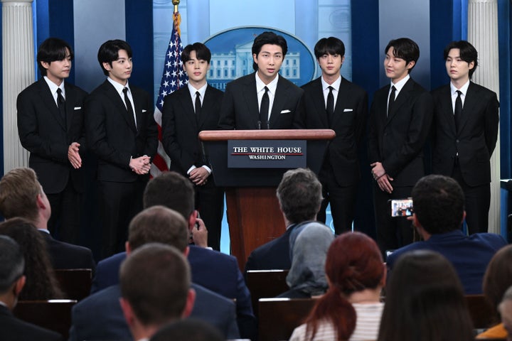 Korean band BTS appears at the daily press briefing on Tuesday.