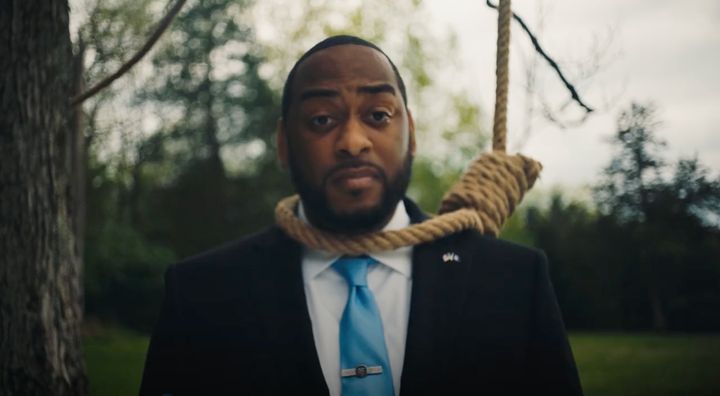 Kentucky Senate candidate Charles Booker (D) wears a noose in a new campaign ad that criticizes GOP Sen. Rand Paul for blocking federal anti-lynching legislation in 2020.