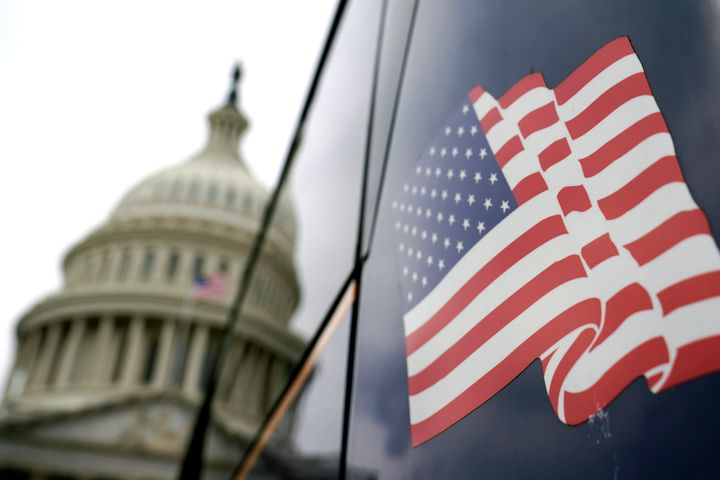 An American flag is seen, on Capitol Hill. Monday, March 7, 2022 in Washington. (AP Photo/Mariam Zuhaib)