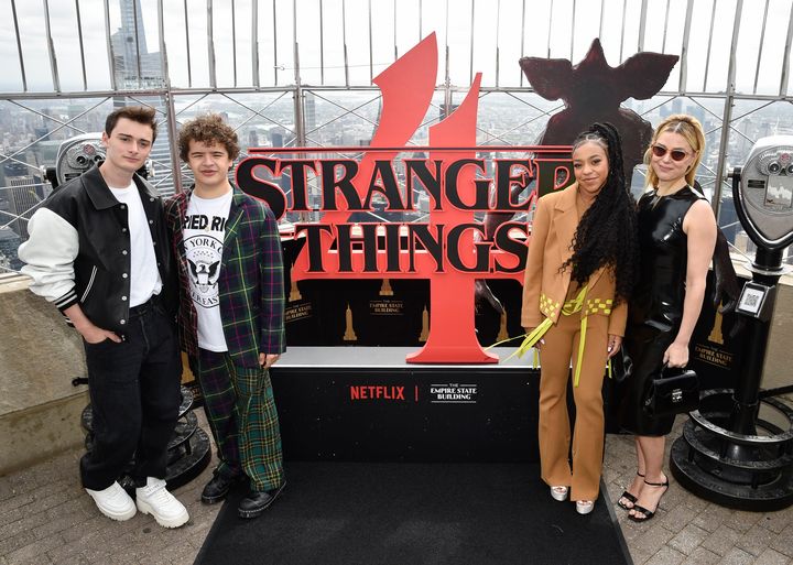 Actors Noah Schnapp, from left, Gaten Matarazzo, Priah Ferguson and Cara Buono pose on the 86th floor observatory at the Empire State Building in honor of the "Stranger Things" season four premiere.