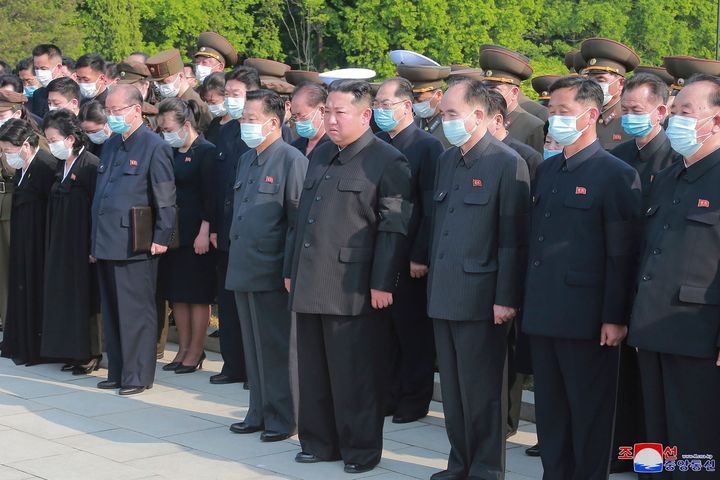 North Korean leader Kim Jong Un, center, and other top officials discussed revising stringent anti-epidemic restrictions as they maintained a widely disputed claim that the country’s first COVID-19 outbreak is slowing.