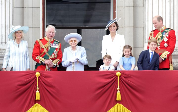 The Queen smiles on the balcony of Buckingham Palace during Trooping the Colour alongside the Duchess of Cornwall, Prince Charles, Prince Louis, the Duchess of Cambridge and Prince Charlotte.