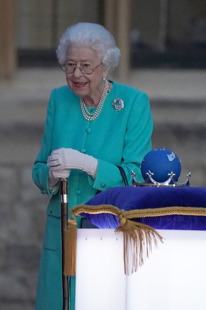 The Queen attends a ceremony to light of the principal beacon outside of Buckingham Palace.