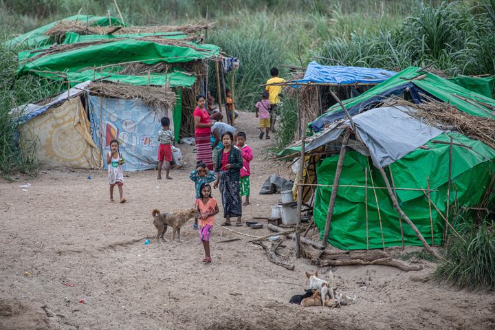 Karen and Burmese refugees who fled fighting between the Myanmar army and insurgent groups since the coup settled temporarily in shelters along the Moei River Bank on the Thai-Myanmar border.