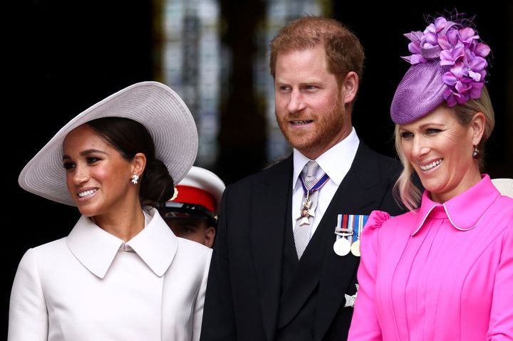 The Duke and Duchess of Sussex pictured with Princess Anne's daughter Zara Tindall. 