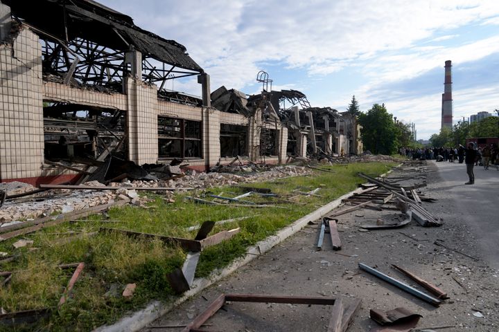Wreckage lie along a street at a railway service facility hit by a Russian missile strike in Kyiv, Ukraine, on June 5, 2022. 
