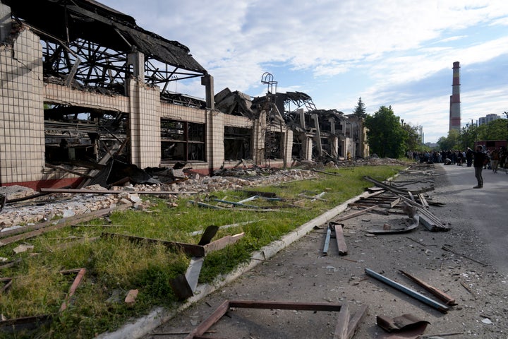 Wreckage lie along a street at a railway service facility hit by a Russian missile strike in Kyiv, Ukraine, on June 5, 2022.