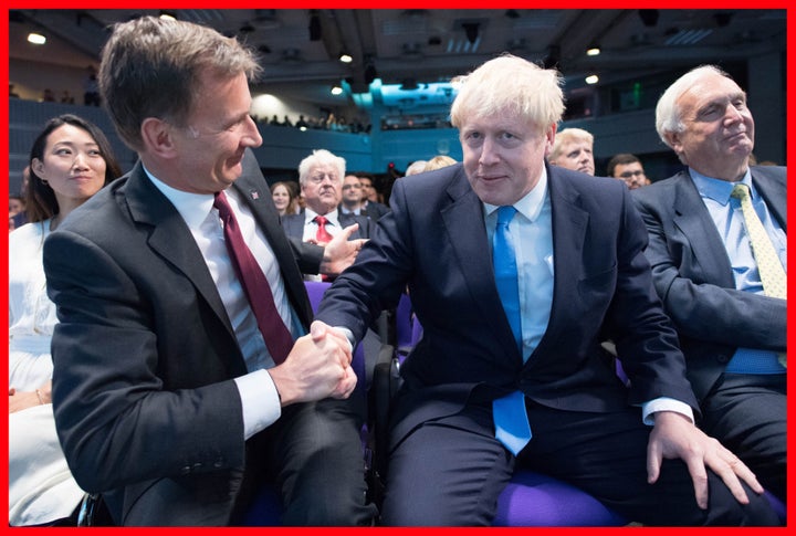 Jeremy Hunt (left) congratulates Boris Johnson at the Queen Elizabeth II Centre in London where he was announced as the new Conservative party leader.