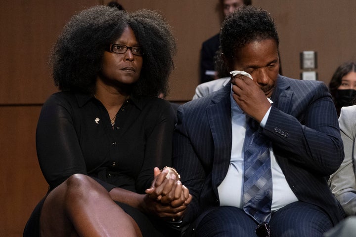 People react as Garnell Whitfield, Jr., of Buffalo, N.Y., whose mother, Ruth Whitfield, was killed in the Buffalo Tops supermarket mass shooting, testifies about his mother at a Senate Judiciary Committee hearing on domestic terrorism, Tuesday, June 7, 2022, on Capitol Hill in Washington.