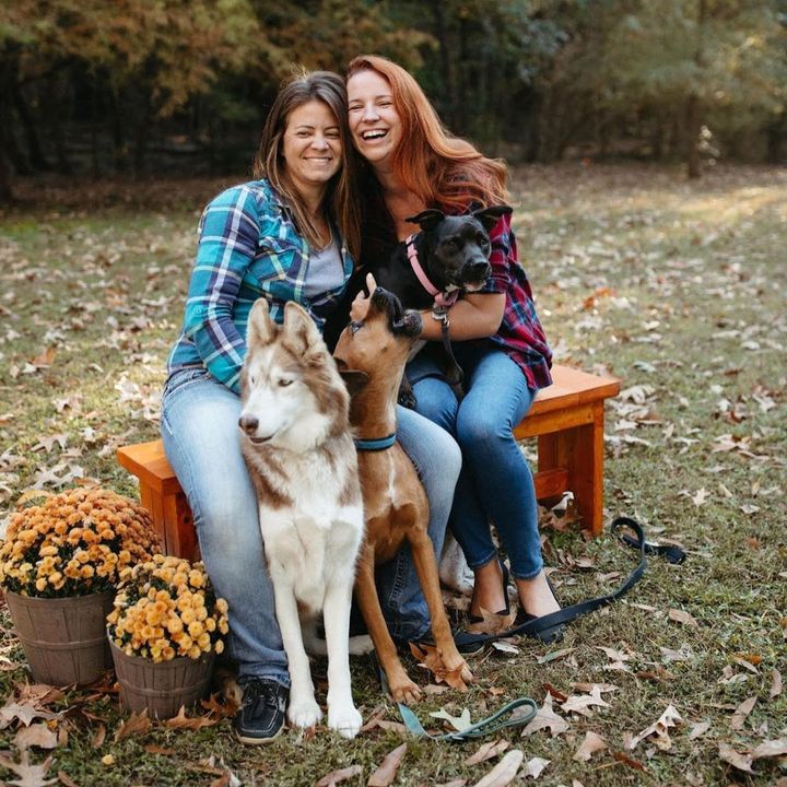 The author (right) and Kelsey with their three rescue dogs Bu, Romeo, and Ruthie, in Greenville, North Carolina.