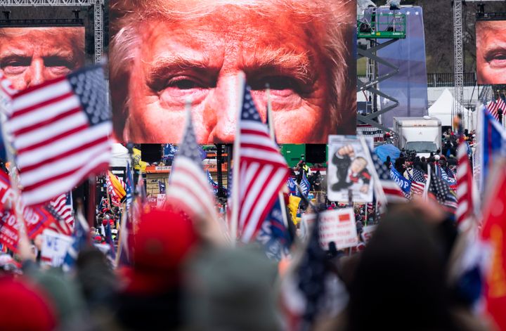 An image of President Donald Trump appears on video screens before his speech to supporters from the Ellipse at the White House on Jan. 6, 2021, as Congress prepared to certify the Electoral College vote. 