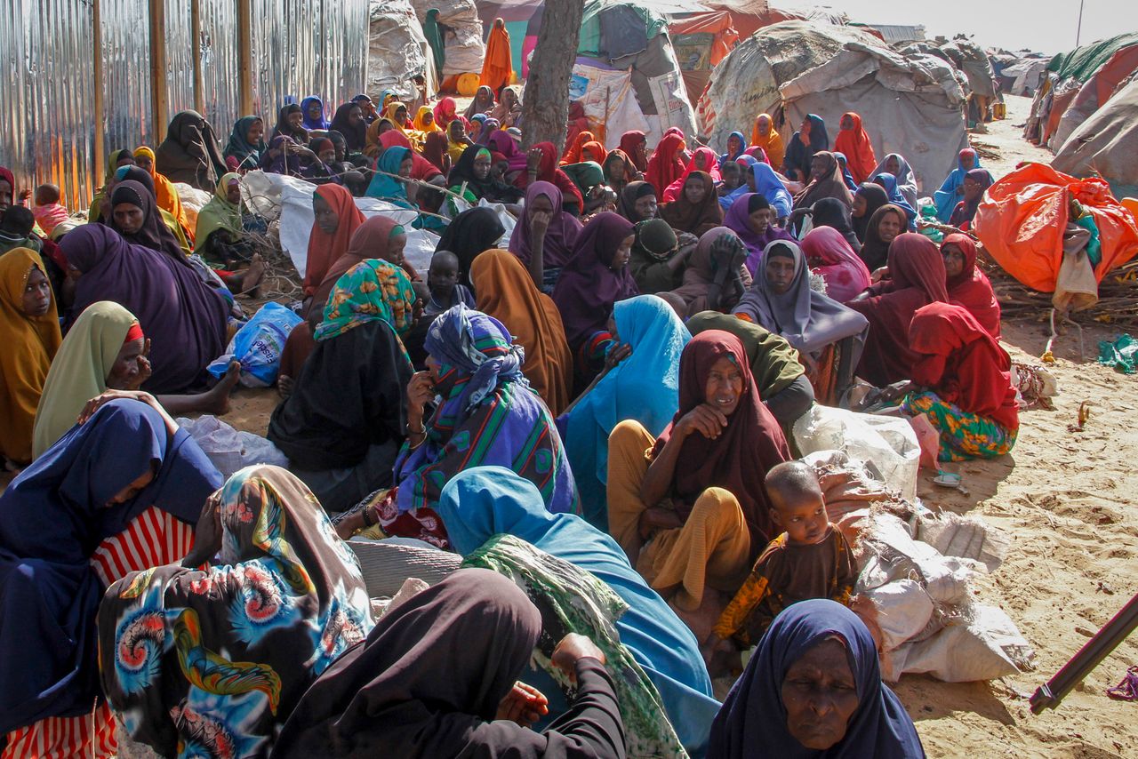 Somalis who fled drought-stricken areas sit at a makeshift camp on the outskirts of Mogadishu. More people are arriving every day.