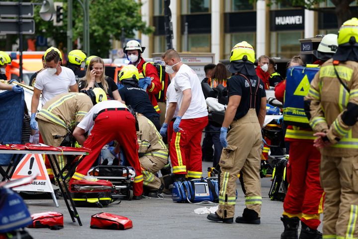 Rescue workers work at the site where one person was killed and eight injured when a car drove into a group of people in central Berlin on June 8, 2022. - A police spokeswoman said the driver was detained at the scene after the car ploughed into a shop front in a busy shopping street in Charlottenburg district. It was not clear whether the crash was intentional.