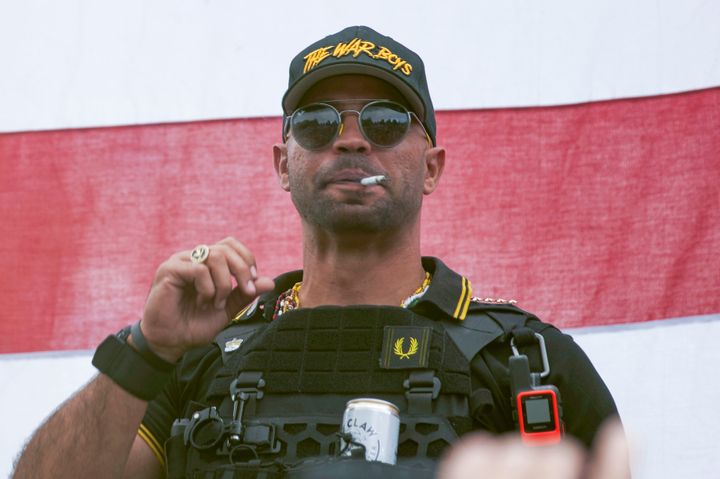In this Sept. 26, 2020, photo, Proud Boys leader Henry "Enrique" Tarrio wears a hat that says "The War Boys" during a rally in Portland, Oregon.