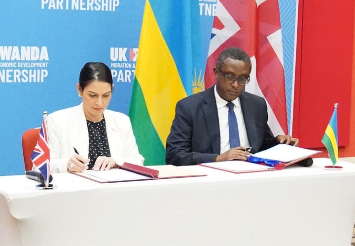 Home secretary Priti Patel and Rwandan minister for foreign affairs and international co-operation, Vincent Biruta, sign a memorandum of understanding.