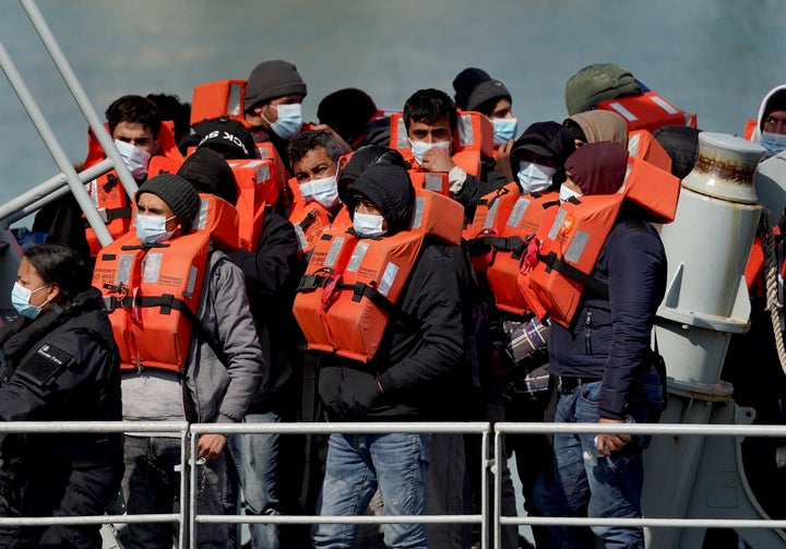 A group of people thought to be migrants are brought in to Dover, Kent, following a small boat incident in the Channel.