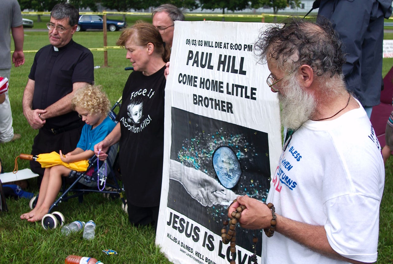 Abortion protesters picket outside Florida State Prison where former Presbyterian minister Paul Hill was executed Sept. 3, 2003.