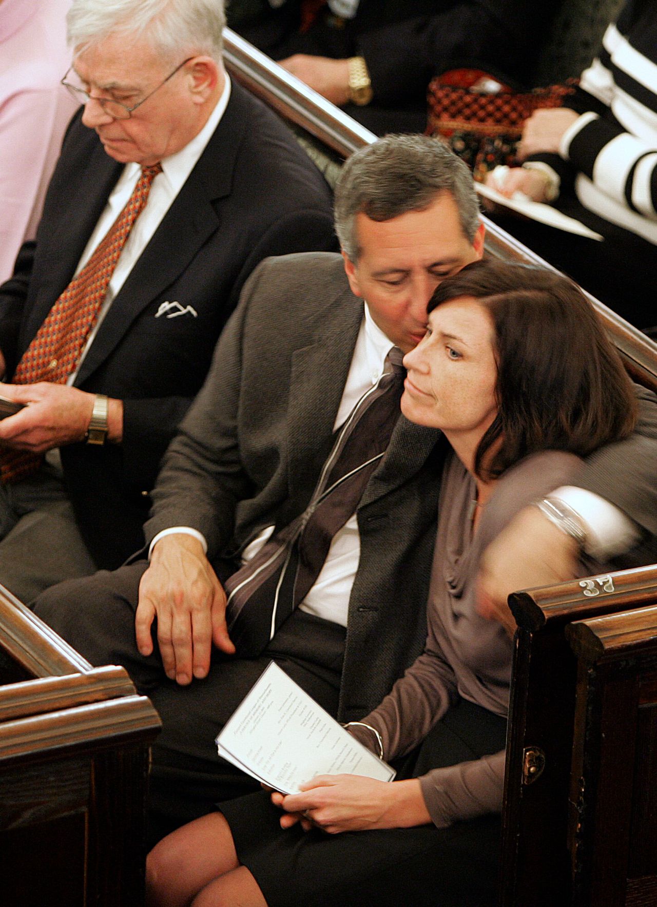 Phil Cerrone consoles Meghan Lowney after she spoke at a memorial service for her sister, Shannon Lowney, on Jan. 12, 2005, at the Arlington Street Church in Boston. The service was held in memory of Shannon Lowney and Lee Ann Nichols, who were killed by John Salvi in abortion clinic shootings in Brookline, Massachusetts, 10 years earlier. 
