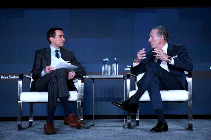 Andrew Ross Sorkin and Howard Schultz speak on stage at the New York Times DealBook/DC policy forum on June 9 in Washington, D.C.