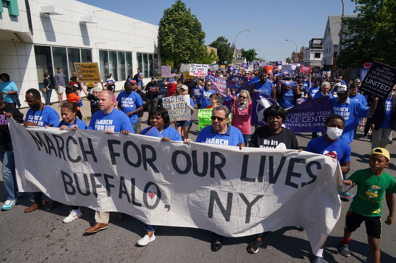 Protesters march down Jefferson Avenue at the site of the Tops massacre during a March for Our Lives rally in support of gun control on Saturday in Buffalo, New York.