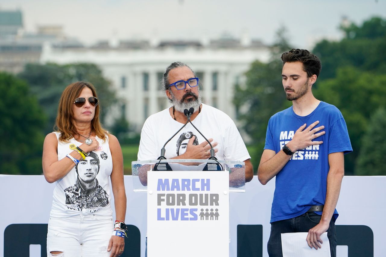 Parkland victim Joaquin Oliver's parents Manuel Oliver, center, and Patricia Oliver, left, stand with Parkland survivor and activist David Hogg, right, during the second March for Our Lives rally in Washington.