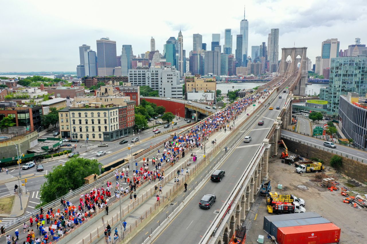 Large crowds are seen as they cross the Brooklyn Bridge in New York City to protest the March for Our Lives.