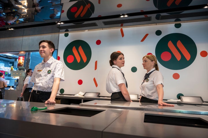 Staff members wait for visitors at a newly opened fast food restaurant in a former McDonald's outlet in Bolshaya Bronnaya Street in Moscow, Russia, on June 12, 2022.
