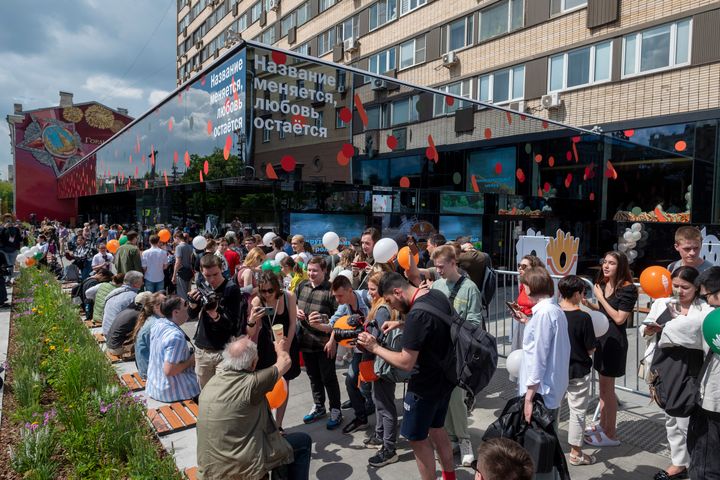 People lineup to visit a newly opened fast food restaurant in a former McDonald's outlet in Bolshaya Bronnaya Street in Moscow, Russia, on June 12, 2022. The sign reads "The Name Changes, Love Remains." 
