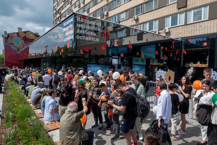 People lineup to visit a newly opened fast food restaurant in a former McDonald's outlet in Bolshaya Bronnaya Street in Moscow, Russia, on June 12, 2022. The sign reads 