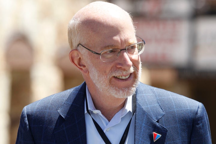 In this June 23, 2012, file photo, campaign counsel Ben Ginsberg walks at a private donors' conference for Republican presidential candidate Mitt Romney at The Chateaux at Silver Lake at Deer Valley Resort in Park City, Utah.