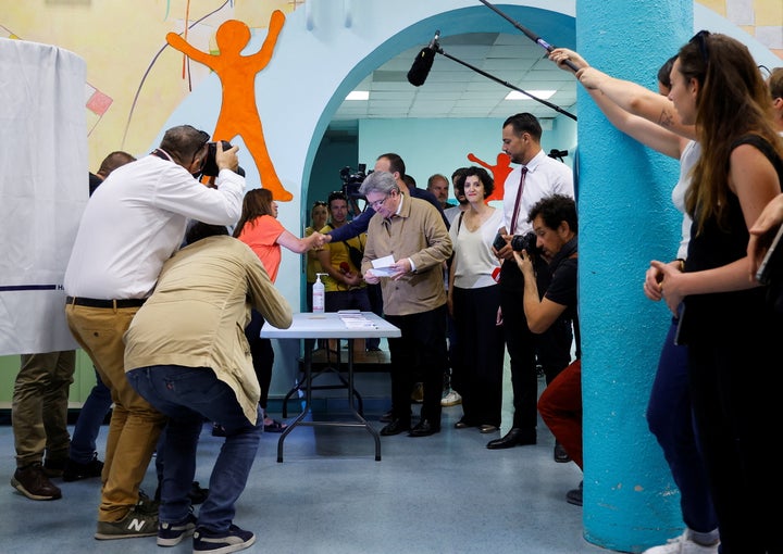 Jean-Luc Melenchon, leader of French far-left opposition party La France Insoumise (France Unbowed), member of Parliament and leader of left-wing coalition New Ecologic and Social People's Union (NUPES), collects ballots to vote in the first round of French parliamentary elections, at a polling station in Marseille, France, June 12, 2022. REUTERS/Eric Gaillard