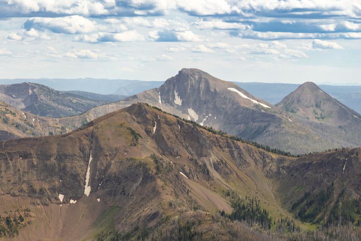 First Peoples Mountain (center) is sandwiched between Top Notch Peak (front) and Mt. Stevenson (back right) as seen from Avalanche Peak in Yellowstone National Park.