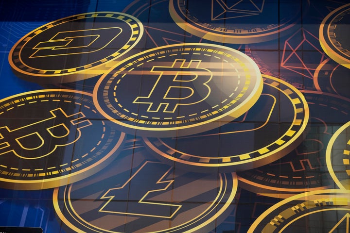 FILE - An advertisement of Bitcoin, one of the cryptocurrencies, is displayed on a building in Hong Kong, on Nov. 18, 2021. Bitcoin and other cryptocurrencies were collapsing in price Monday, June, 13, 2022 after the major crypto lender Celsius halted all withdrawals citing “extreme market conditions." It is the second collapse of a part of the crypto world in the last two months. (AP Photo/Kin Cheung, File)