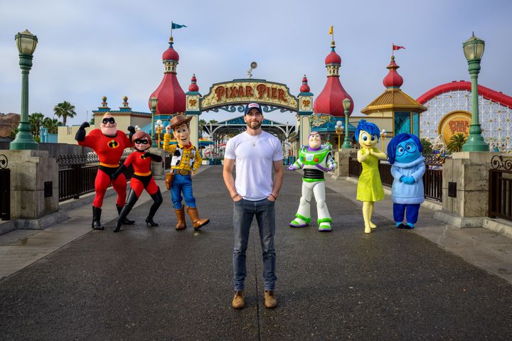 Chris Evans poses with Disney and Pixar characters during a visit to Disney's California Adventure Park on Saturday.
