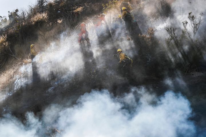 Duarte, CA, Sunday, June 12, 2022 - Dozens of fire crews battle the Opal Fire, Shifting winds and air drops slowed it's progress to 25 acres burned with little containment. (Robert Gauthier/Los Angeles Times via Getty Images)