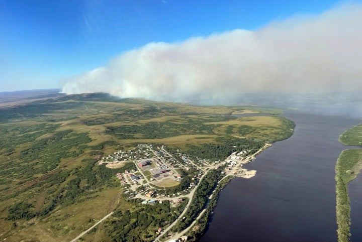 This June 10, 2022, aerial photo provided by the Bureau of Land Management Alaska Fire Service shows a tundra fire burning near the community of St. Mary's, Alaska. The largest documented wildfire burning through tundra in southwest Alaska was within miles St. Mary's and another nearby Alaska Native village, Pitkas Point, prompting officials Friday to urge residents to prepare for possible evacuation. (Ryan McPherson/Bureau of Land Management Alaska Fire Service via AP)