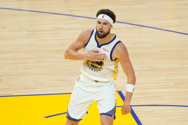 Klay Thompson celebrates a three-point basket.