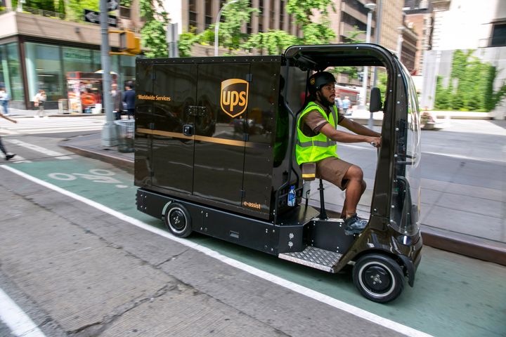 Delivery giant UPS is going back to the future in its latest way to get packages to the doors of its millions of customers. The company is considering launching a fleet of pedal- and battery-powered cargo cycles for deliveries in some of the country's most congested cities. (AP Photo/Ted Shaffrey)