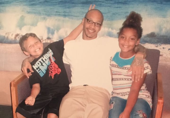 Thomas Butler at Clallam Bay Corrections Center with his children in 2018.