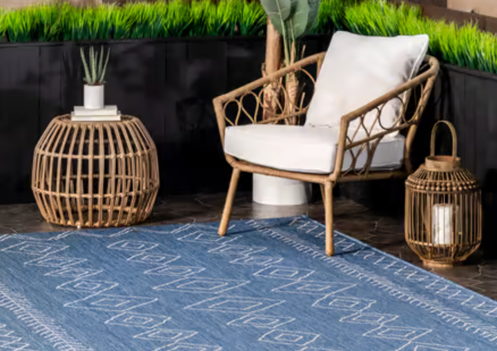 <a href="https://goto.rugsusa.com/c/2706071/555367/9280?subId1=indooroutdoorrugs-griffinwynne-06152022-62a9ec75e4b04a617356ff38&u=https%3A%2F%2Fwww.rugsusa.com%2Frugsusa%2Frugs%2Frugs-usa-moroccan-diamonds-indooroutdoor%2FBlue%2F200OWDN23A-P.html" target="_blank" role="link" rel="sponsored" class=" js-entry-link cet-external-link" data-vars-item-name="A Moroccan-style argyle rug from Rugs USA" data-vars-item-type="text" data-vars-unit-name="62a9ec75e4b04a617356ff38" data-vars-unit-type="buzz_body" data-vars-target-content-id="https://goto.rugsusa.com/c/2706071/555367/9280?subId1=indooroutdoorrugs-griffinwynne-06152022-62a9ec75e4b04a617356ff38&u=https%3A%2F%2Fwww.rugsusa.com%2Frugsusa%2Frugs%2Frugs-usa-moroccan-diamonds-indooroutdoor%2FBlue%2F200OWDN23A-P.html" data-vars-target-content-type="url" data-vars-type="web_external_link" data-vars-subunit-name="article_body" data-vars-subunit-type="component" data-vars-position-in-subunit="0">A Moroccan-style argyle rug from Rugs USA</a> that you can use indoors or outside.