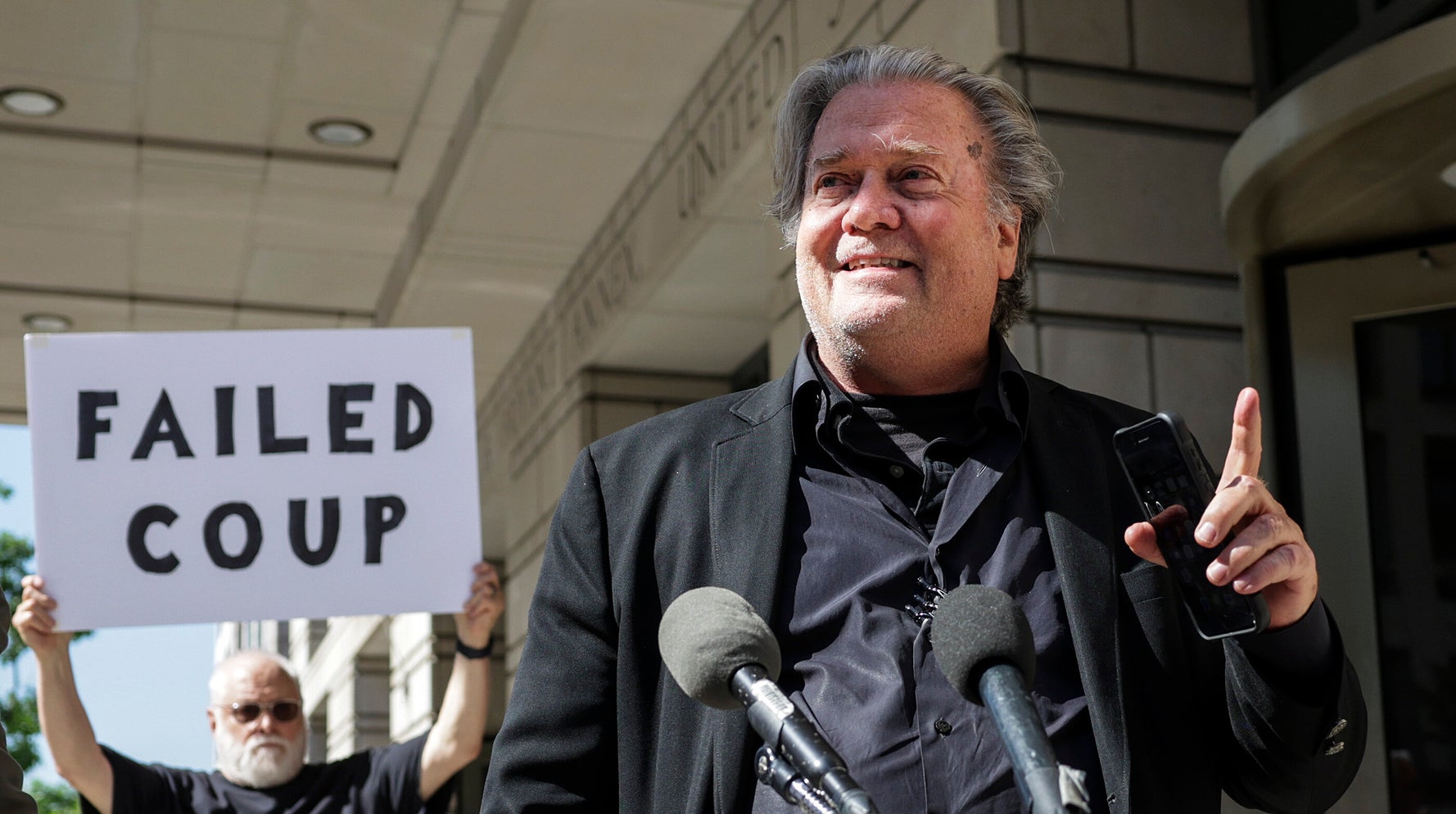 1 Strategically Placed Protest Sign Ruins Steve Bannon’s Attempt To Control Narrative