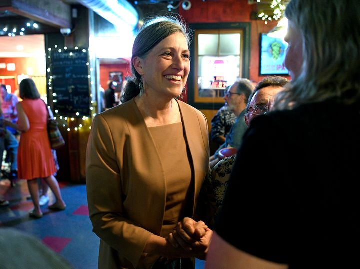 Democratic U.S. House nominee Monica Tranel talks with a supporter at a June 7 election watch event in Missoula, Montana. She says "every voter should question Zinke’s motives and what he’s trying to hide."