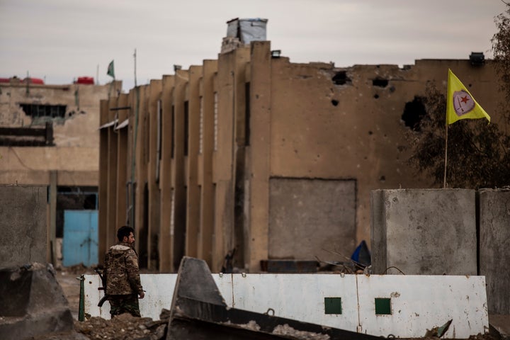 A Syrian Democratic Forces soldier keeps watch by a prison that was attacked by Islamic State militants, in Hassakeh, Syria, on Feb. 8, 2022. Hardly a day passes in northern Syria without Kurdish fighters and opposition gunmen backed by Turkey exchanging gunfire and shelling.
