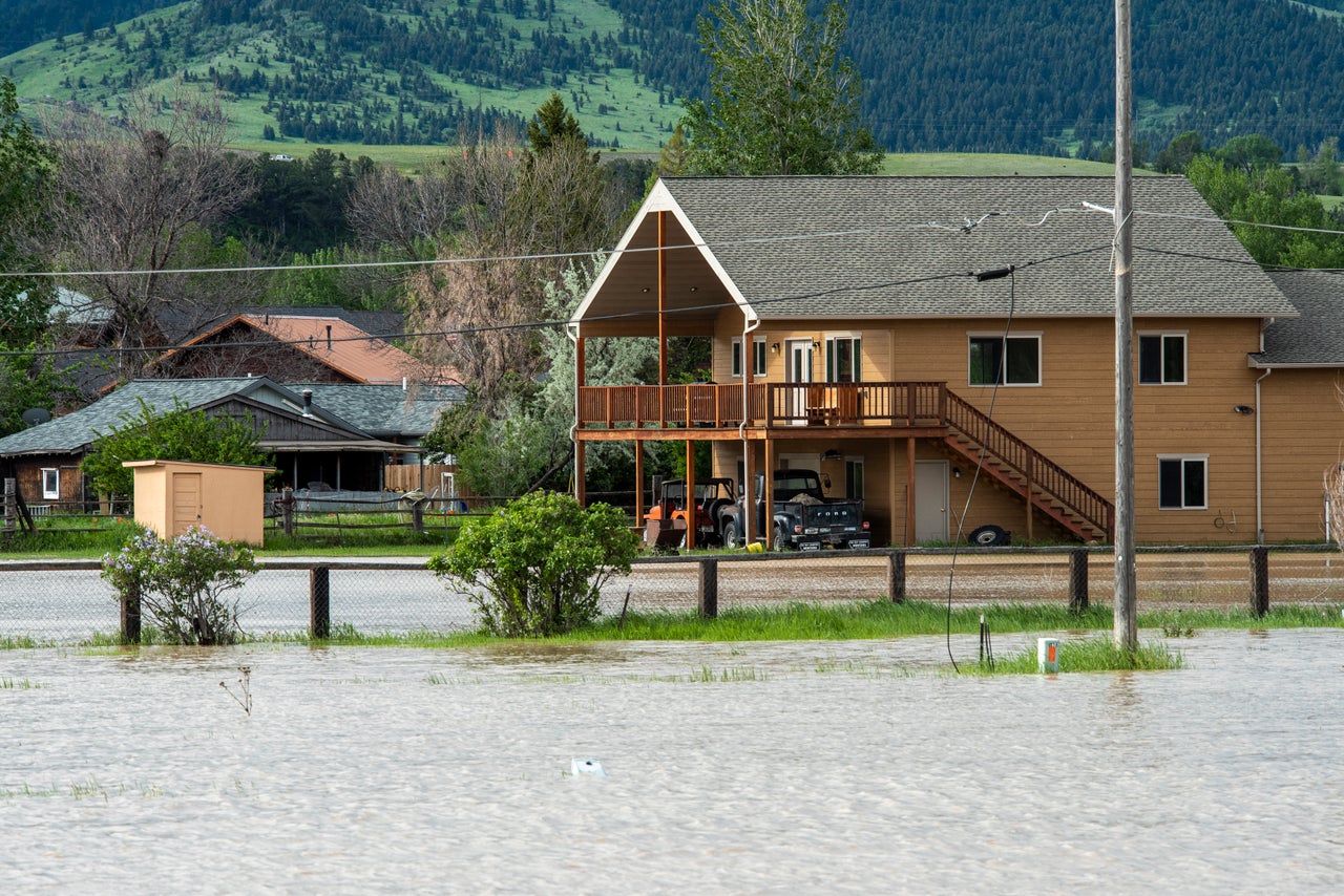 Floodwaters course through Livingston, Montana, on Tuesday. The Yellowstone River hit a record high flow from rain and snow melt from the mountains in and around Yellowstone National Park.