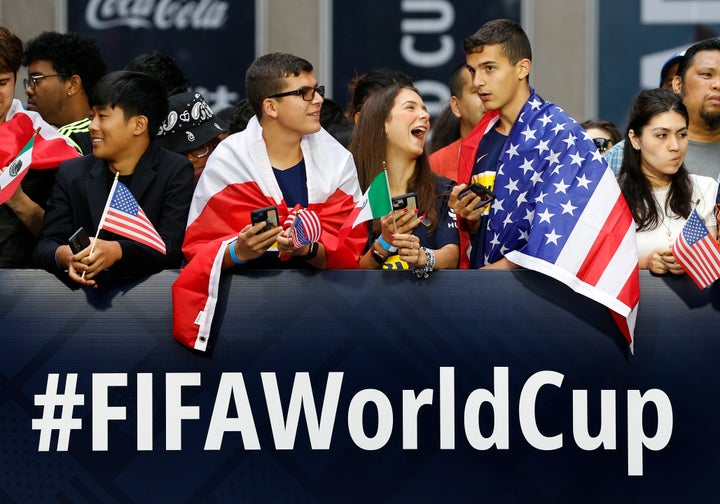 Fans wait along 6th Ave. for FIFA's announcement of the names of the host cities for the 2026 World Cup soccer tournament, on June 16, 2022, in New York.