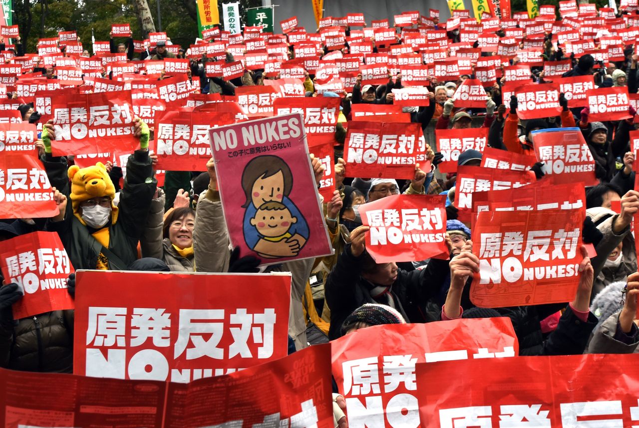 Protesters raise anti-nuclear placards at a rally denouncing nuclear power plants on March 8, 2015, in Tokyo. Thousands of people took part in the demonstration ahead of the fourth anniversary of the tsunami-linked disaster at the Fukushima nuclear plant.