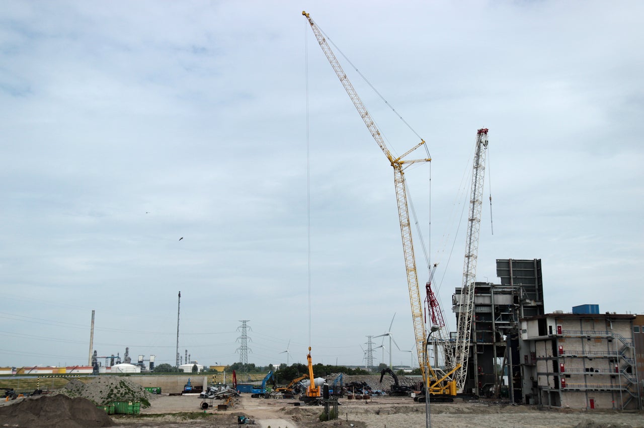 Cranes work to disassemble what remains of the coal-fired power plant that, until recently, operated alongside the Borssele nuclear plant.