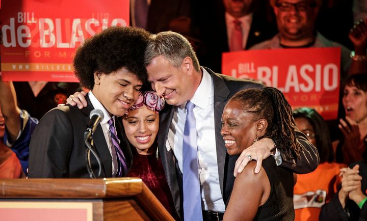 Bill de Blasio embraces his son Dante, left, daughter Chiara, second from left, and wife, Chirlane McCray, right, after polls closed in 2013. The activist left has since turned on him.