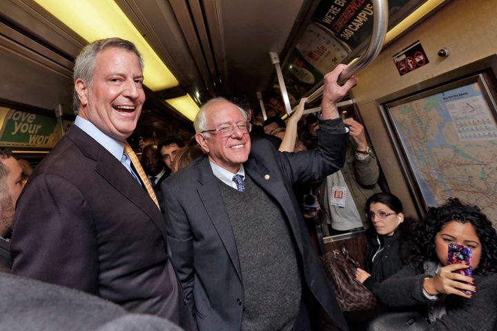 Sen. Bernie Sanders (I-Vt.), right, campaigns for de Blasio's reelection in October 2017. De Blasio endorsed Sanders' presidential bid in 2020 after dropping out of the running himself.